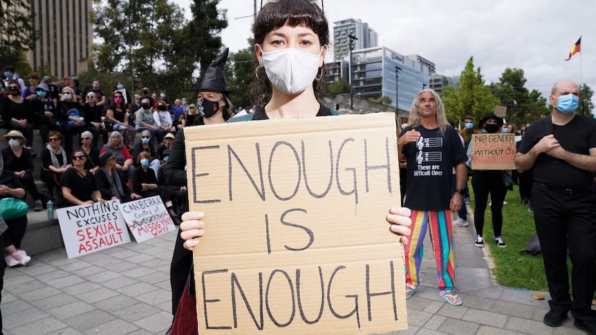 Protester in Victoria Square calling for an end to sexual violence and harassment.