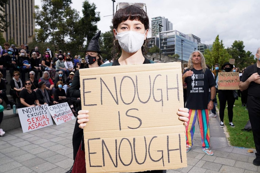 Protester in Victoria Square calling for an end to sexual violence and harassment.