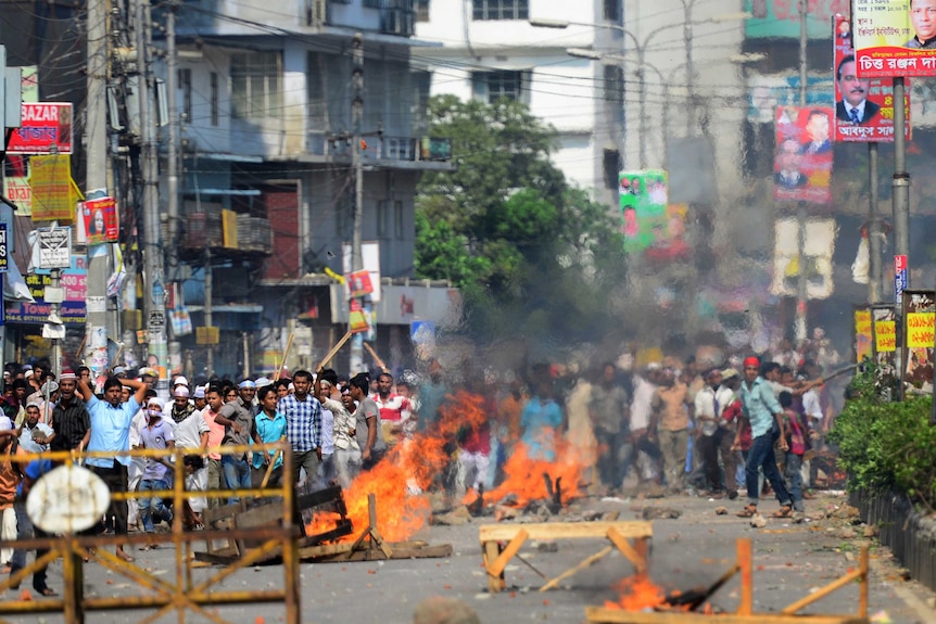 Islamist protestors set fires in the streets during clashes with police in Dhaka on May 5, 2013.