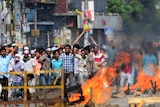 Islamist protestors set fire in the streets during clashes with police in Dhaka on May 5, 2013.