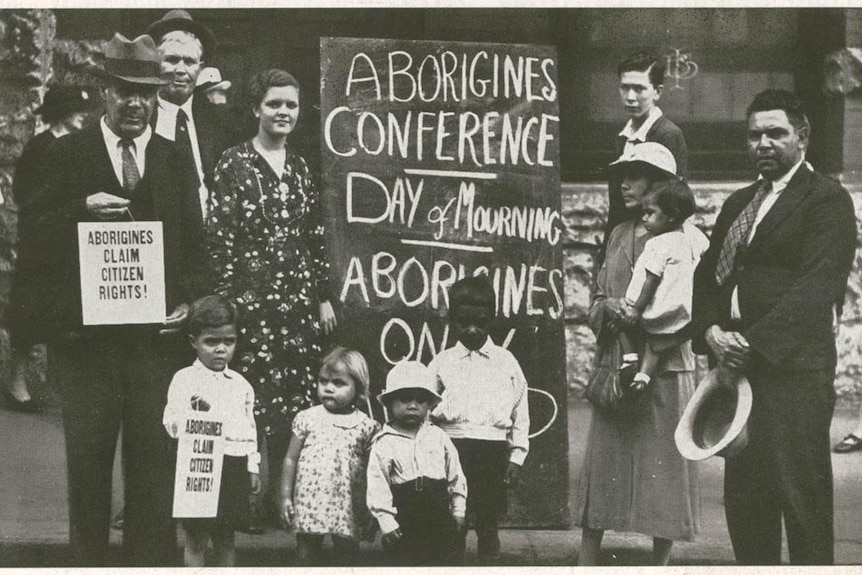 Bill Ferguson holds sign that reads 'Aborigines claim citizens rights'.