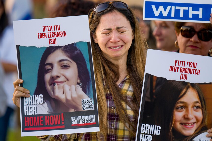 Woman in tears at vigil for Israeli hostages