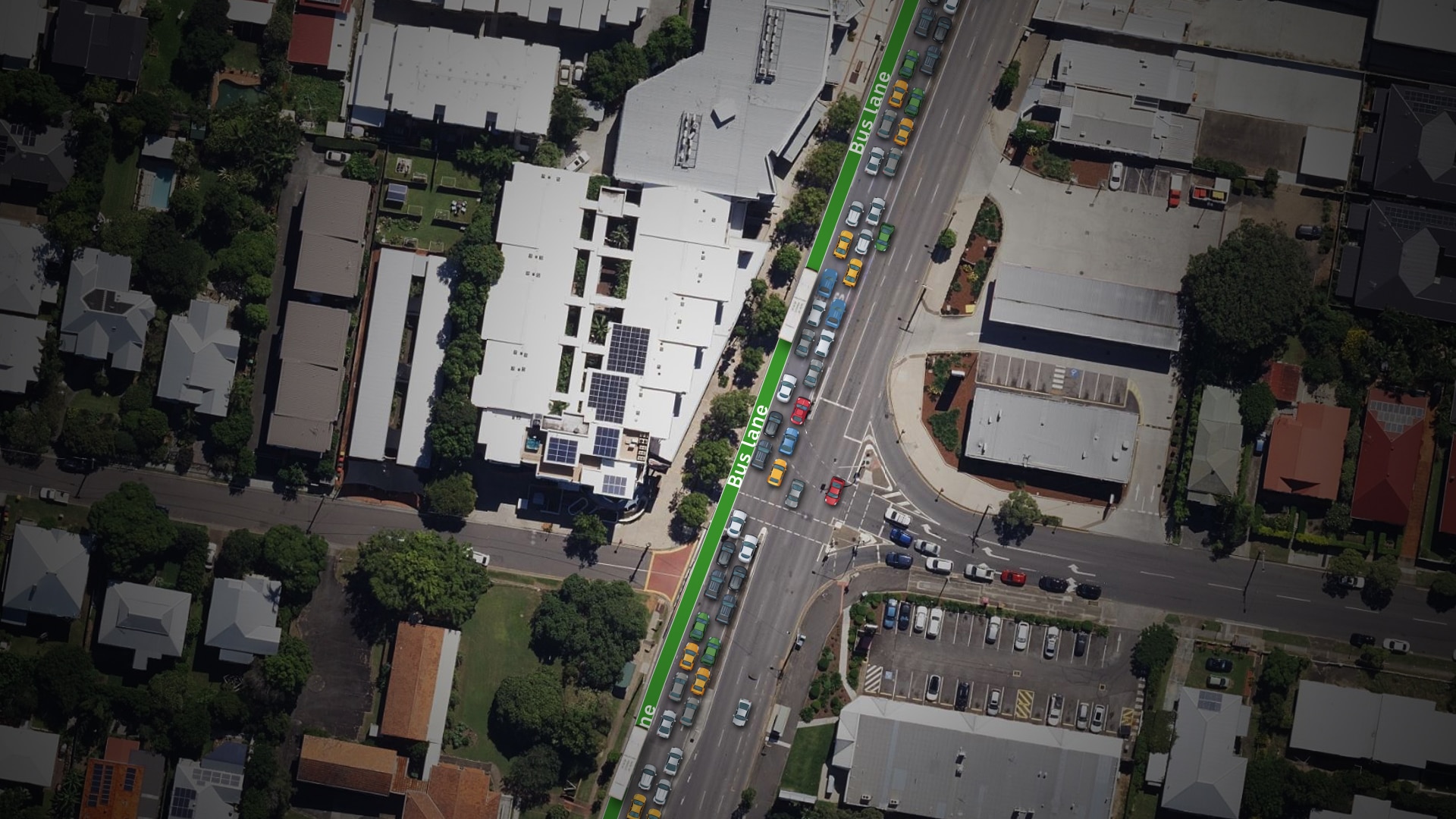 An aerial view of main raods with a highlighted green lane. 