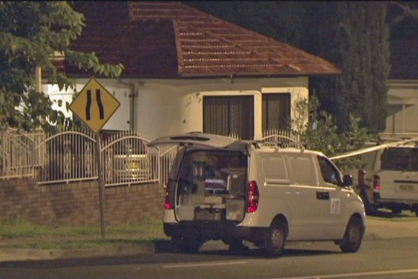 Police collect evidence outside a western Sydney home after shots were fired