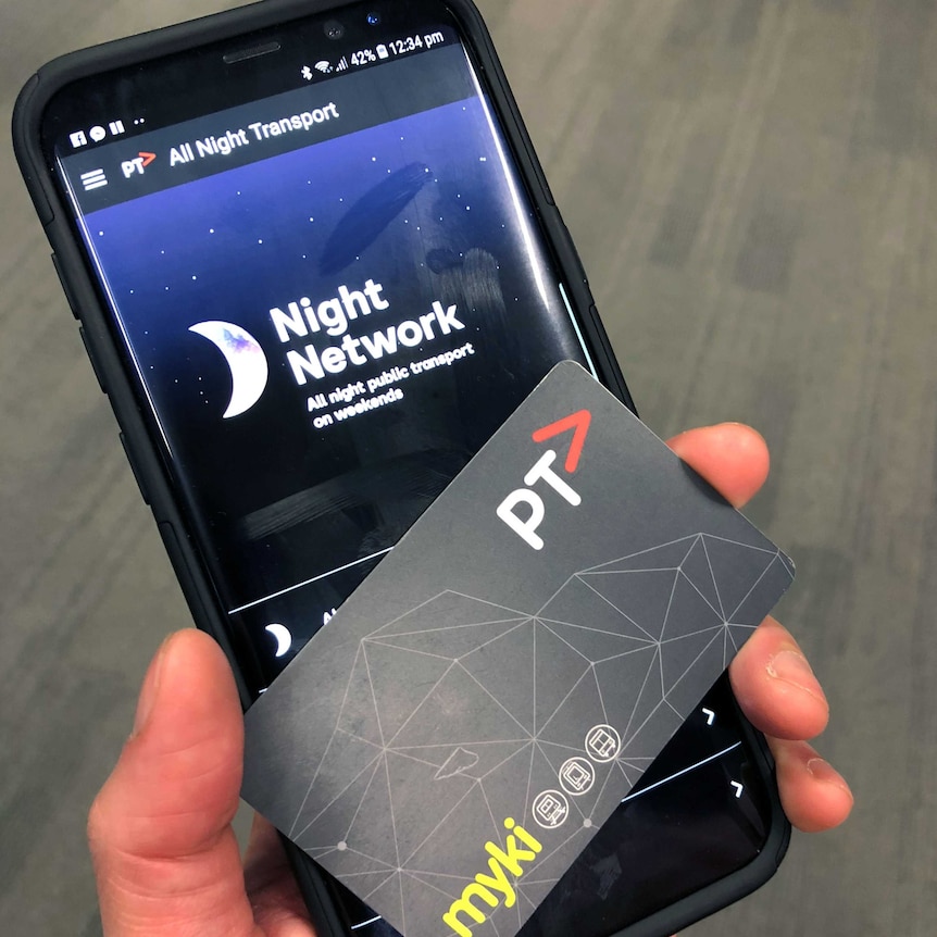 An Android phone with a night network sign on it and a PTV myki card.