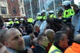 Construction workers clash with police at a building site on Lonsdale Street in Melbourne's CBD