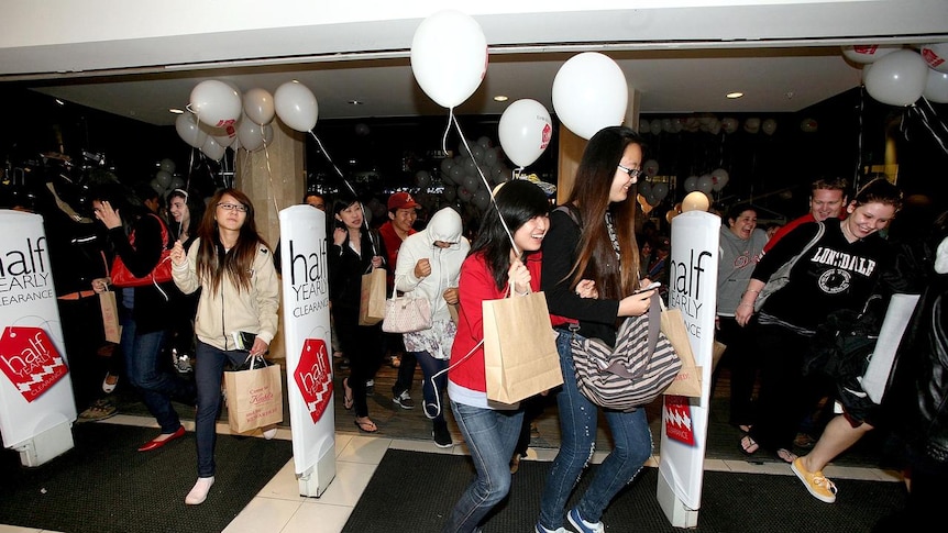 Shoppers rush into a Melbourne department store at the start of the 2010 Boxing Day clearance sales