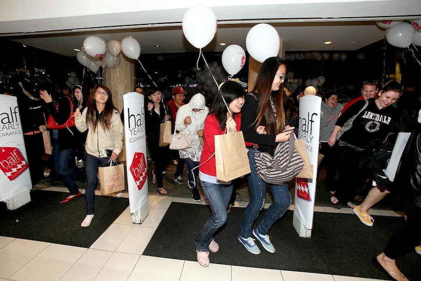 Shoppers rush into a Melbourne department store at the start of the 2010 Boxing Day clearance sales