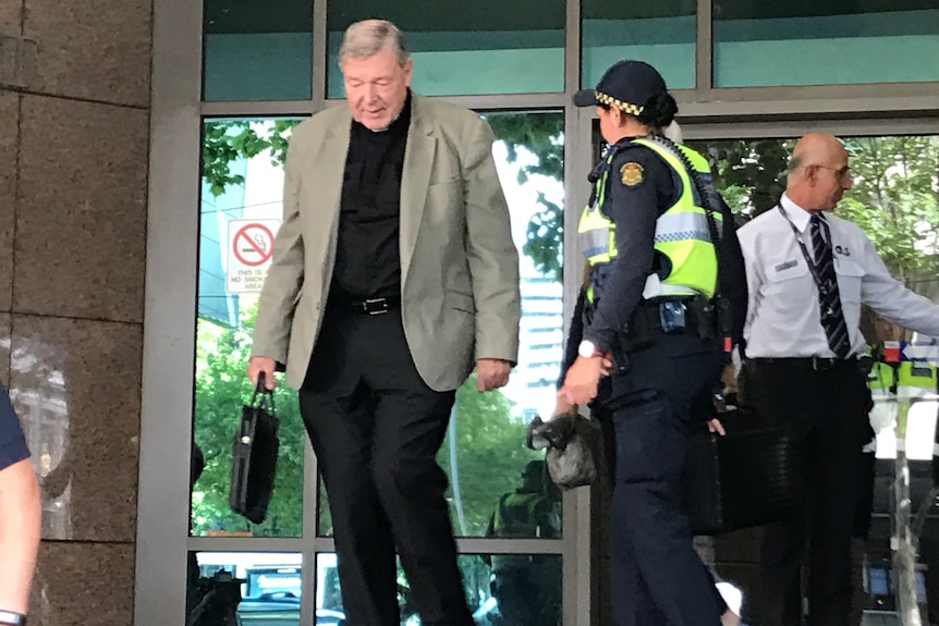 Catholic Cardinal George Pell leaves court.