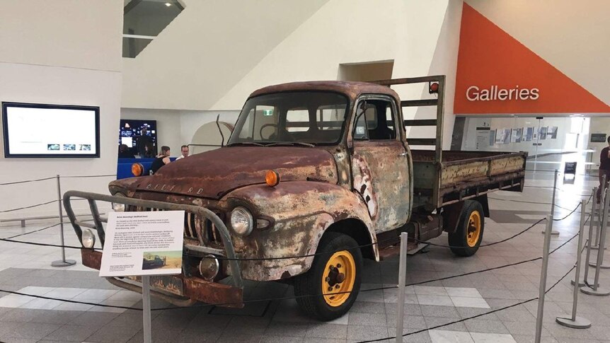 The rusting Bedford truck sits in the foyer of the National Museum of Australia.