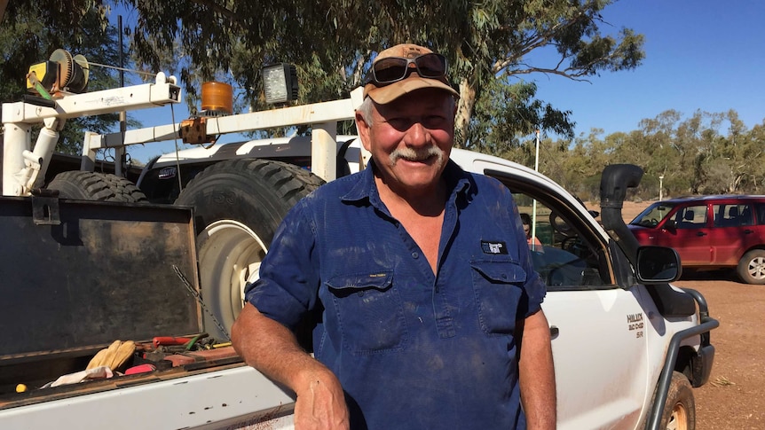 Pastoralist Digby Giles leaning against his ute outside the Wintinna Station workshop.