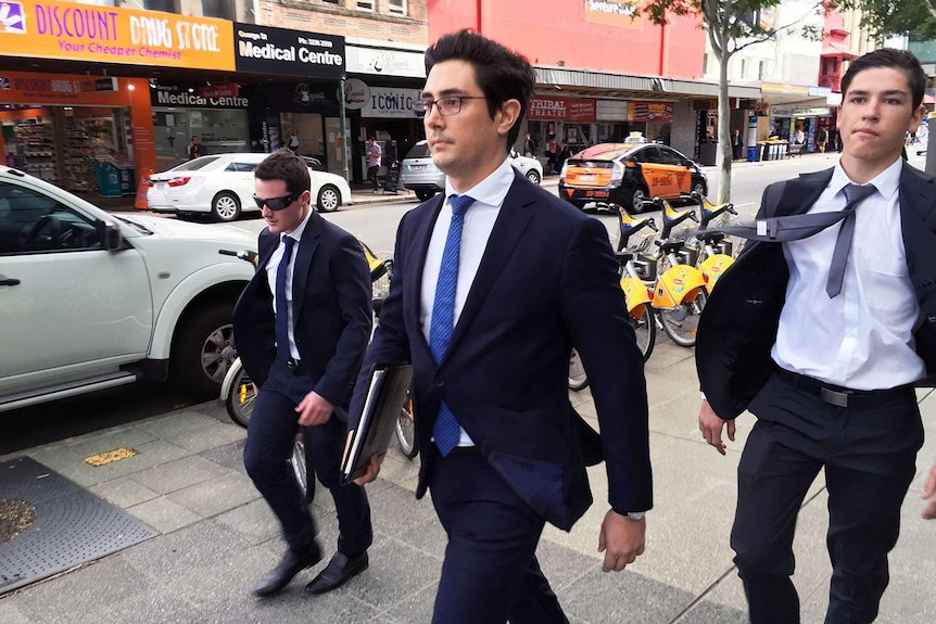 (LtoR) Callum Gibson McKenzie and Hunter Lawrence Jonasen, with lawyer (centre)