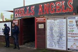 Police stand outside a Hells Angels bikie clubhouse in Melbourne.