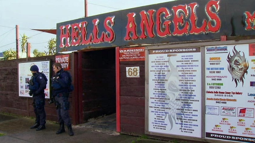 Police stand outside a Hells Angels bikie clubhouse in Melbourne.