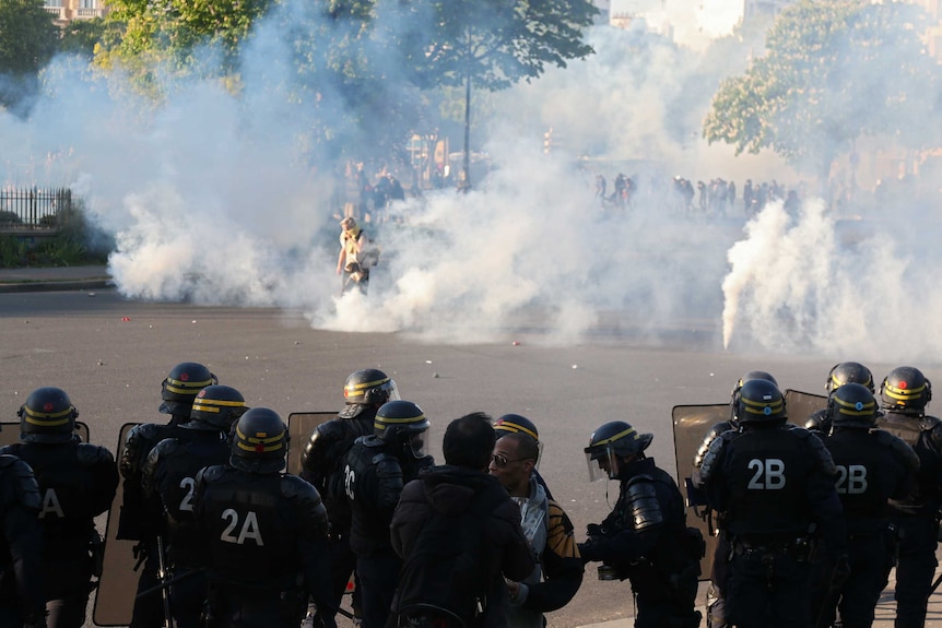 Tear gas and riot police at Place de la Nation in Paris.