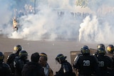 Tear gas and riot police at Place de la Nation in Paris.