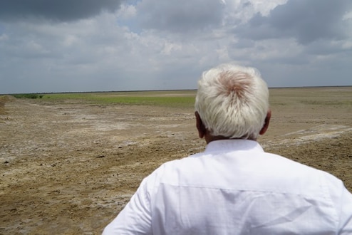 Praduman Sinh surveying the floodplain