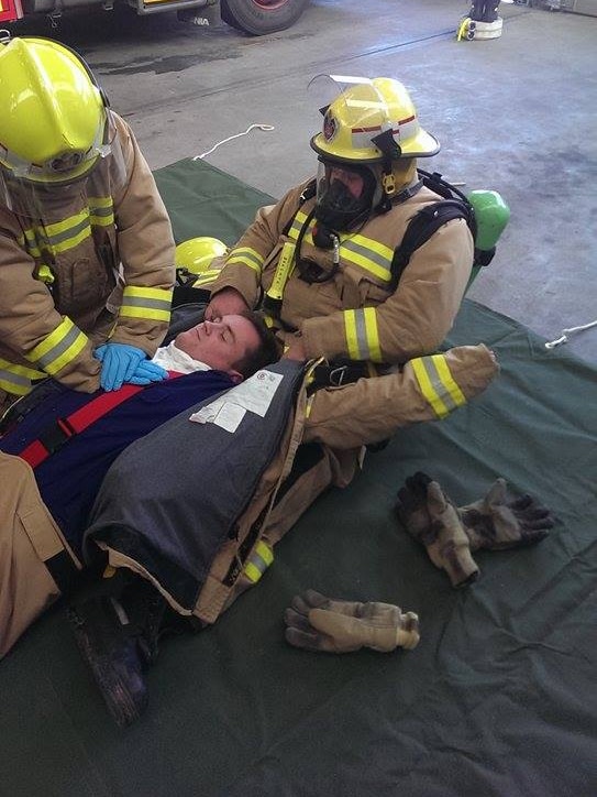 Three firefighters practise the new CPR drill