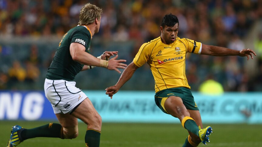 Kick happy ... Kurtley Beale grubbers the ball against the Springboks