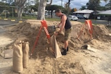 Local Coffs Harbour man digging sand