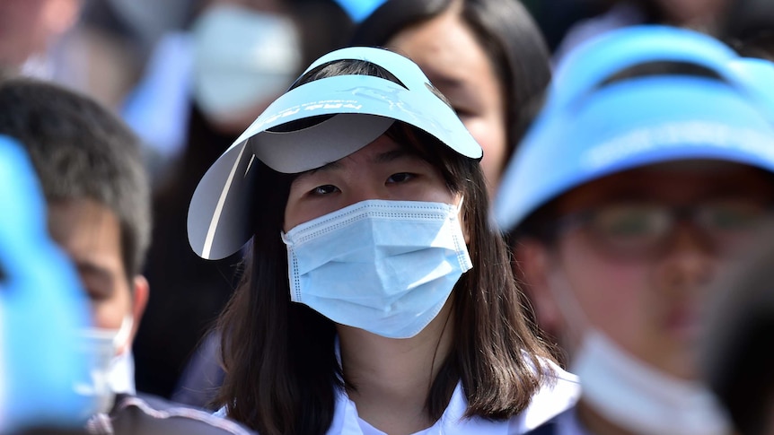 A South Korean student wears a facemask to protect herself from MERS