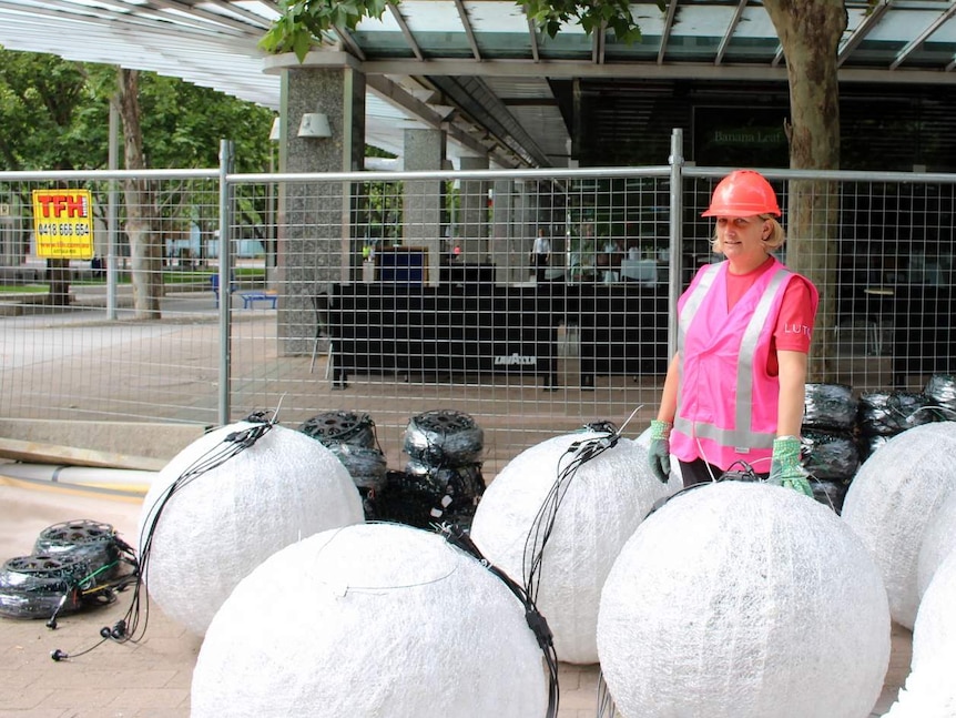 SIDS and Kids ACT volunteer Fran Bink helping install decorations at Christmas Lights in the City, November 2015.