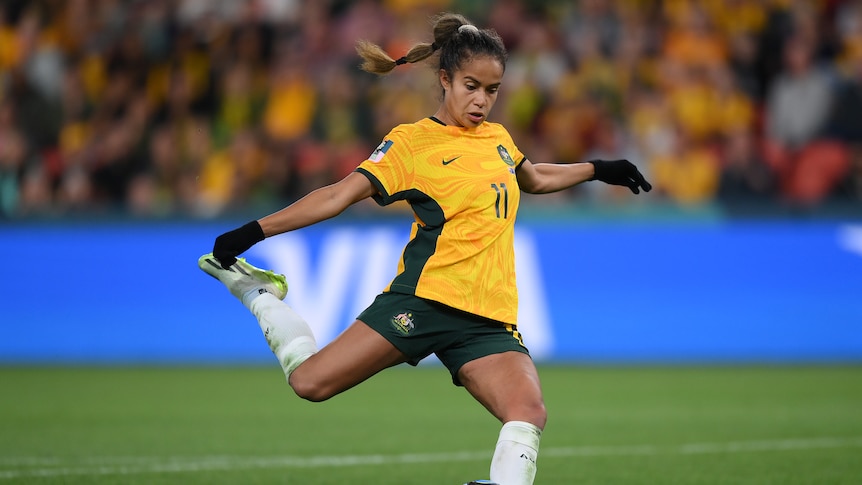 A Matildas player swings her leg through the ball to take a penalty kick during a shootout at the Women's World Cup.