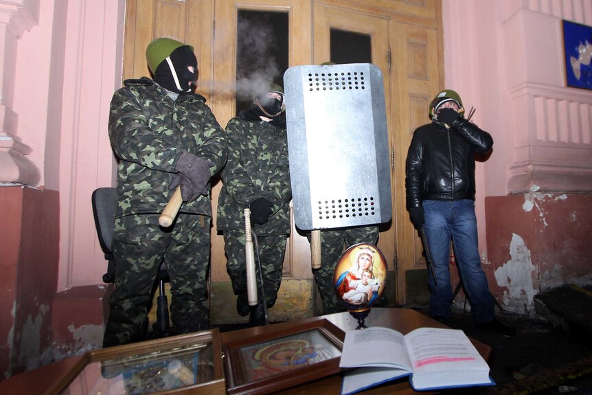 Ukrainian opposition activists guard the occupied justice ministry building