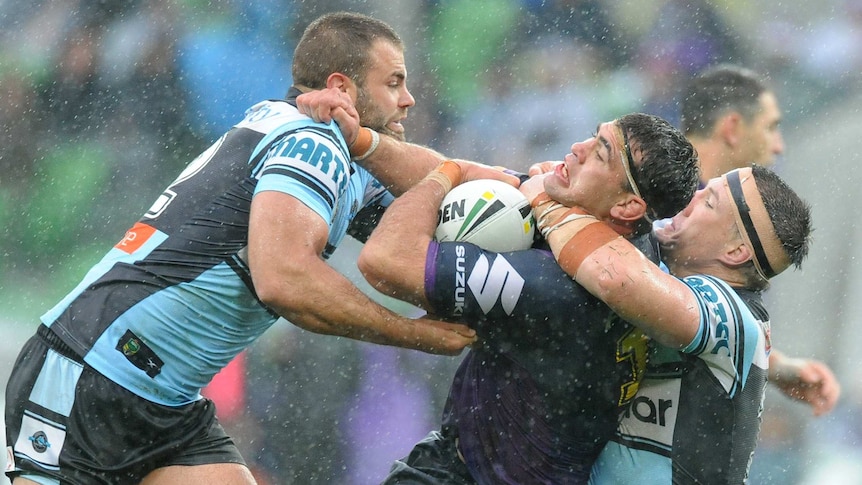 Paul Gallen of the Sharks tackles Dale Finucane of the Storm