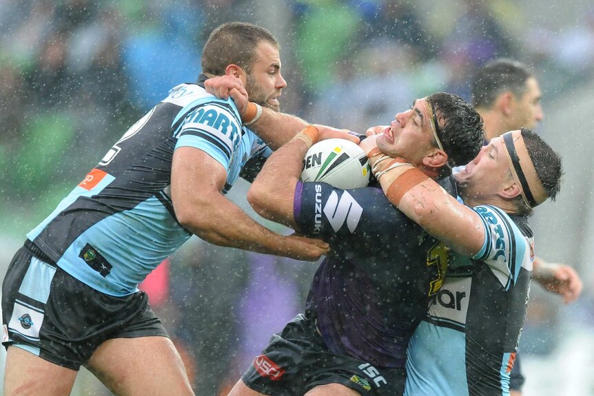 Paul Gallen of the Sharks tackles Dale Finucane of the Storm