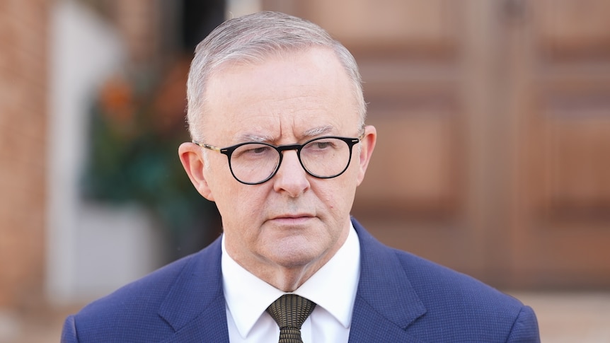 Anthony Albanese speaks to the media outside a chuch