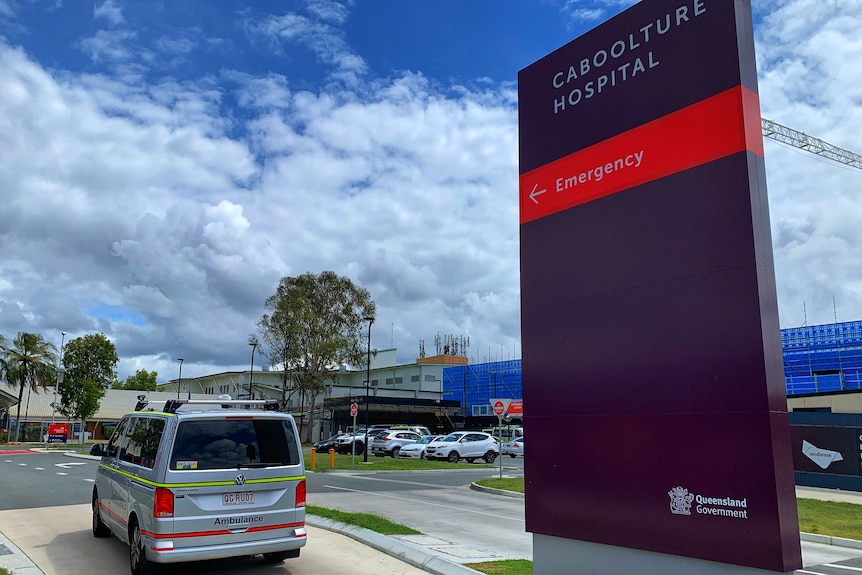 Sign outside Caboolture Hospital emergency entrance and an ambulance.