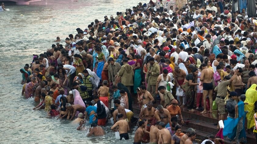 Hindu devotees take a bath on the banks of river Ganges