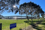 A youth detention centre in the country on a sunny day.