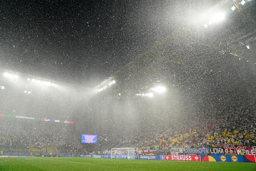 Heavy rain falls during the UEFA EURO 2024 round of 16 match between Germany and Denmark at Football Stadium Dortmund.