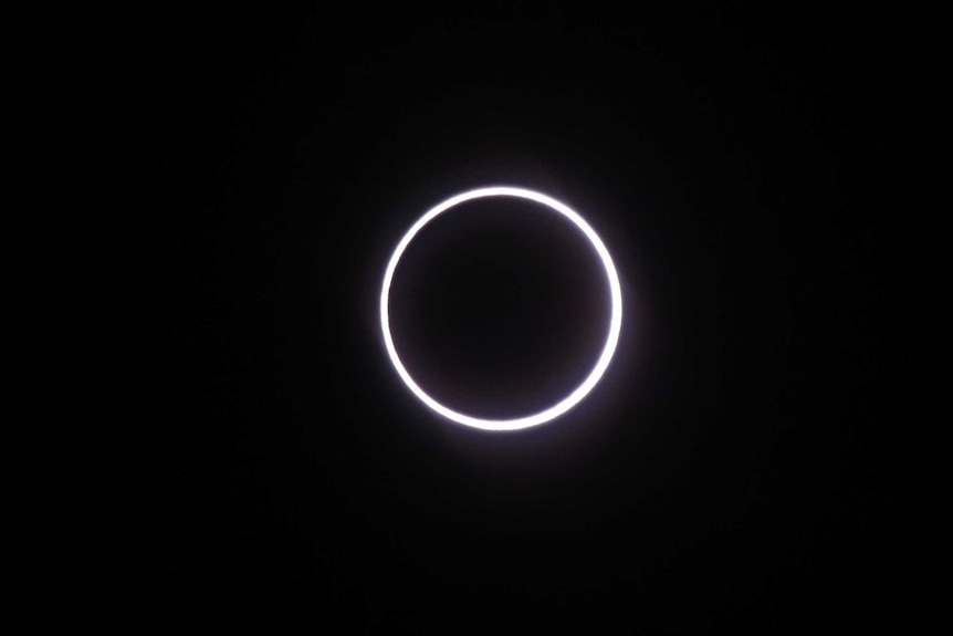 A ring of fire effect is seen around the moon.