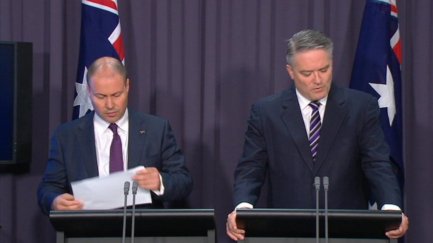 Treasurer Josh Frydenberg and Finance Minister Mathias Cormann release MYEFO at a press conference in Canberra
