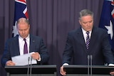 Treasurer Josh Frydenberg and Finance Minister Mathias Cormann release MYEFO at a press conference in Canberra