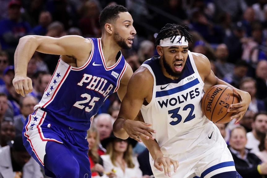 Ben Simmons jostles with Karl-Anthony Towns