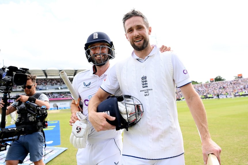 England batters Chris Woakes and Mark Wood smile for the camera as they walk off Headingley after winning the third Ashes Test.