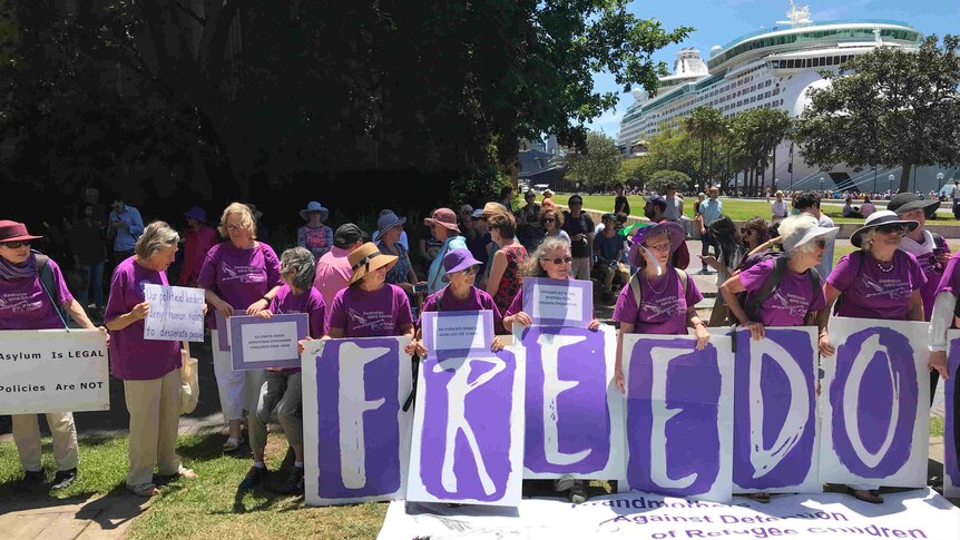 Grandmothers with big Freedom sign.