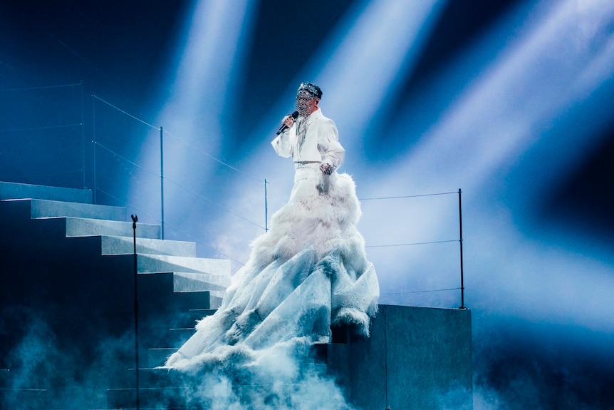 Sheldon Riley in a long white flowing outfit