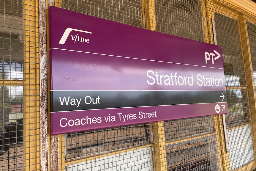 Stratford railway station sign with directions to coach stops