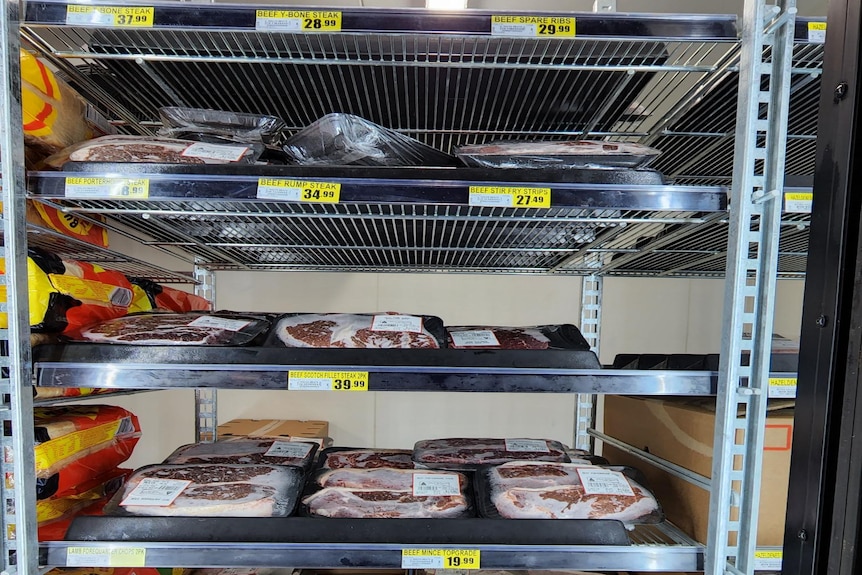 Meat on shelves with price tags