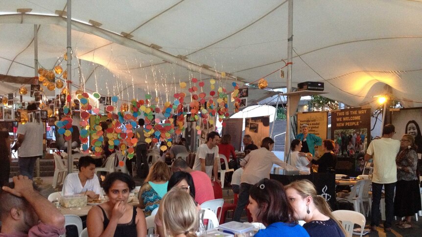 Sydneysiders gathered in Martin Place to take part in the launch of The Welcome Dinner Project.