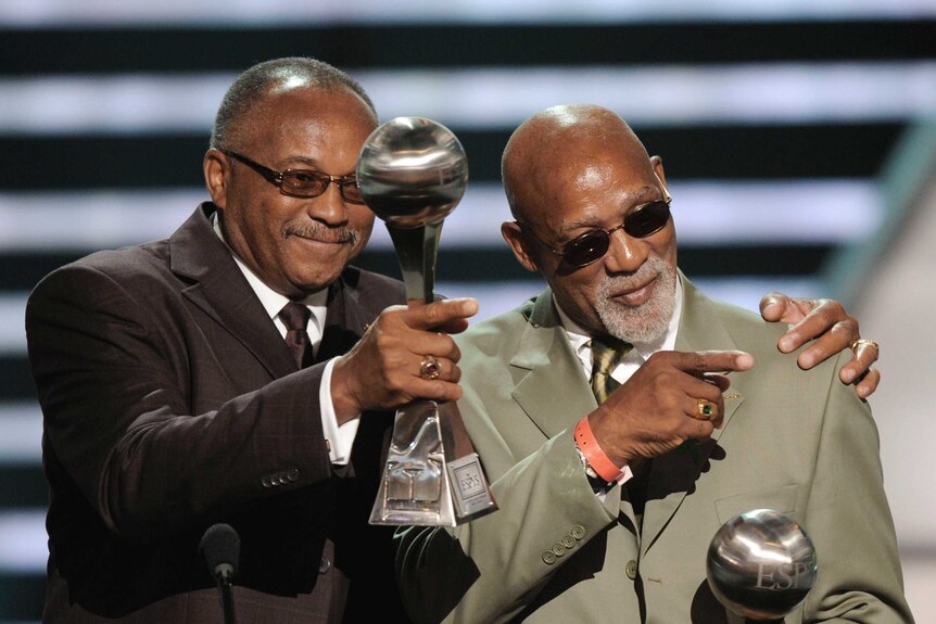 Tommie Smith, left, and John Carlos accepting the Arthur Ashe Award