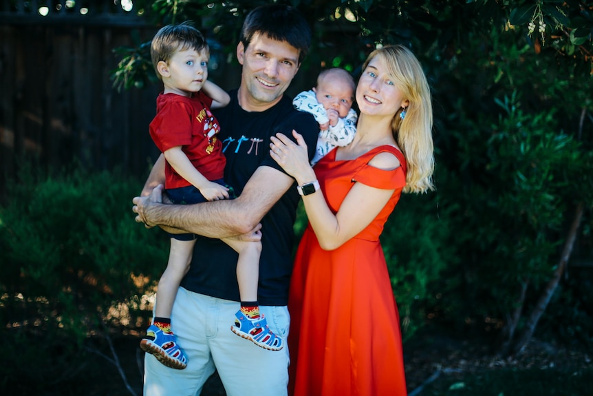 Family portrait of mum, dad and two young children