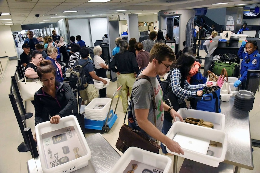 Passengers at a TSA security check