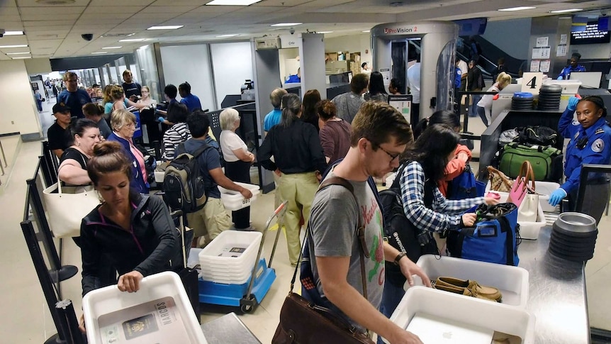 Passengers at a TSA security check