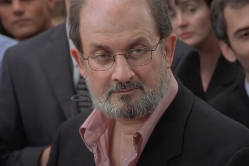 A still of Salman Rushdie's cameo on Bridget Jones' Diary. He looks unimpressed. 